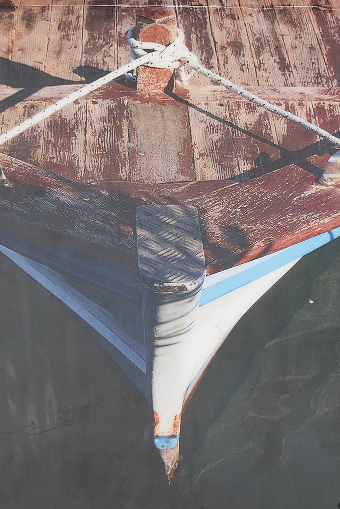 Foto impresa sobre taco de madera con una barca