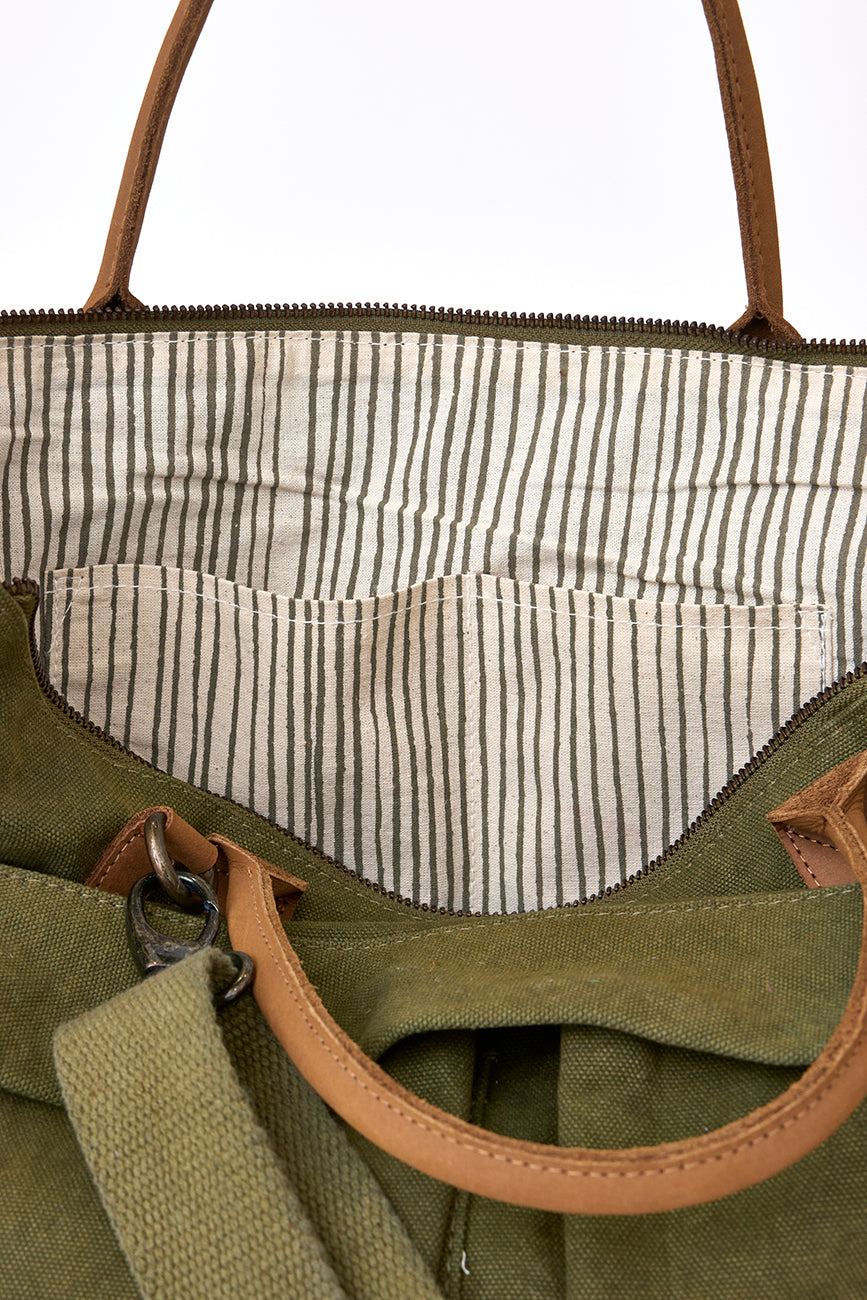 Green canvas bag with striped lining