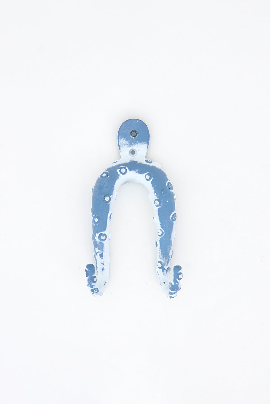 Perchero de metal con forma de pulpo