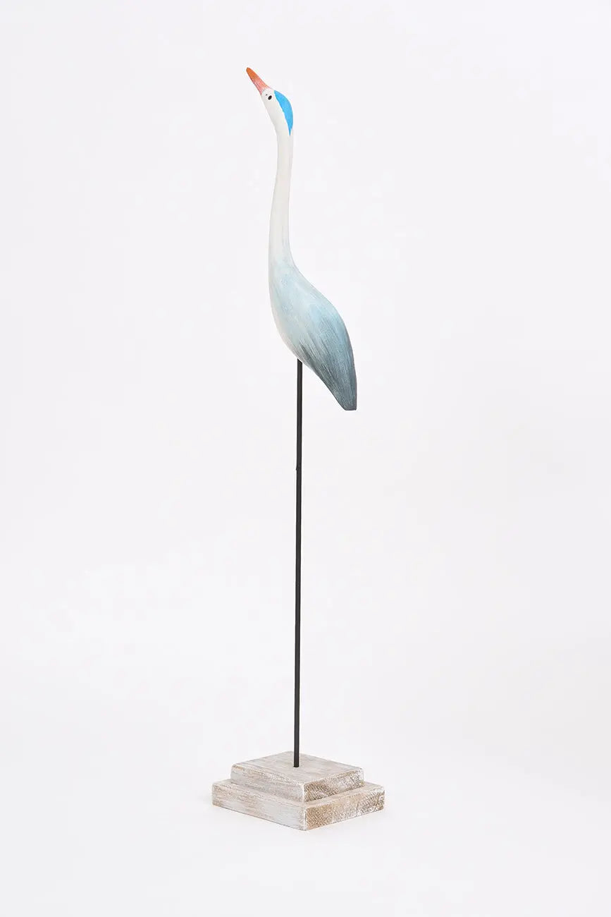 Pájaro con base hecho de madera en tonos azules y turquesa