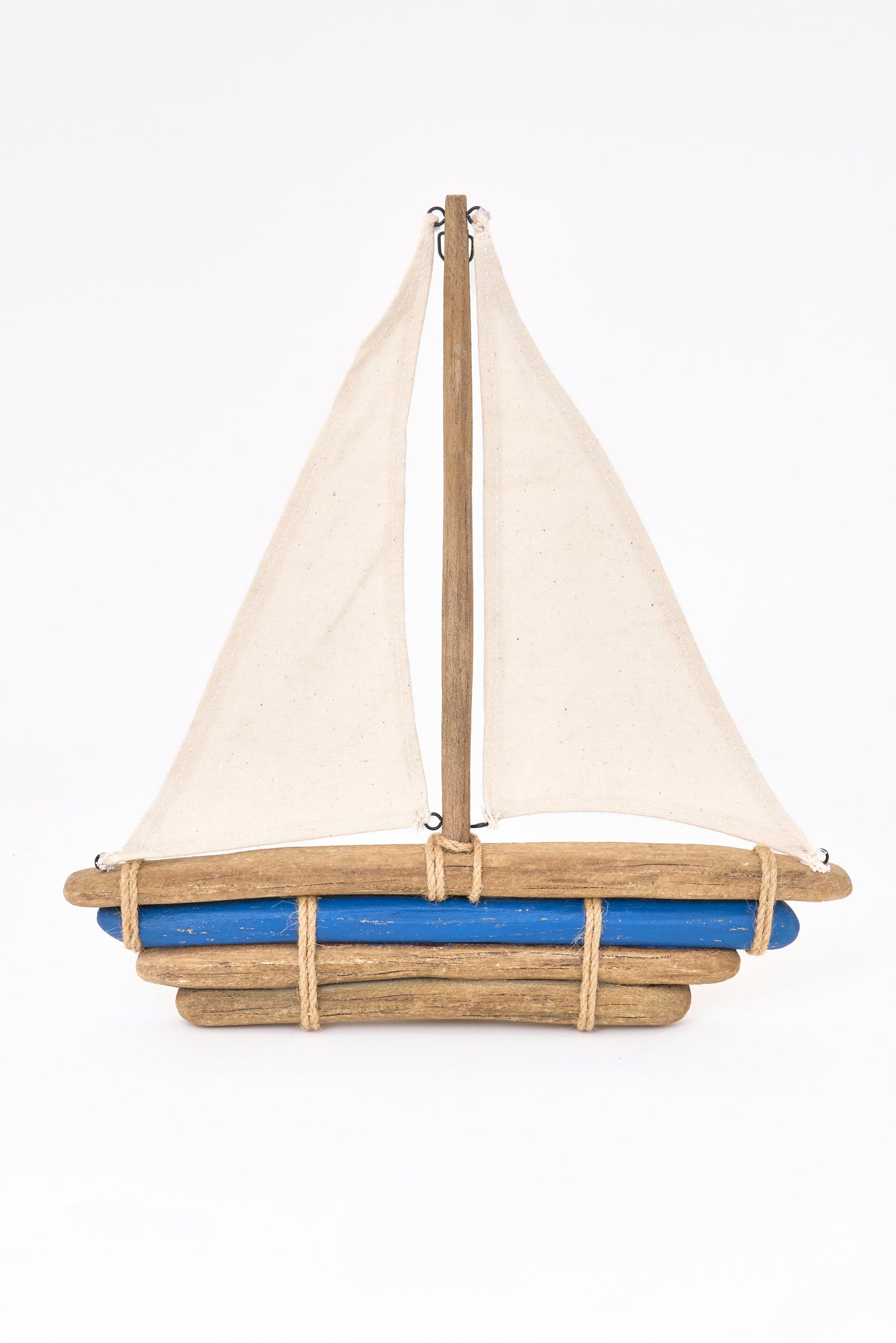 Wooden sailboat with fabric sail