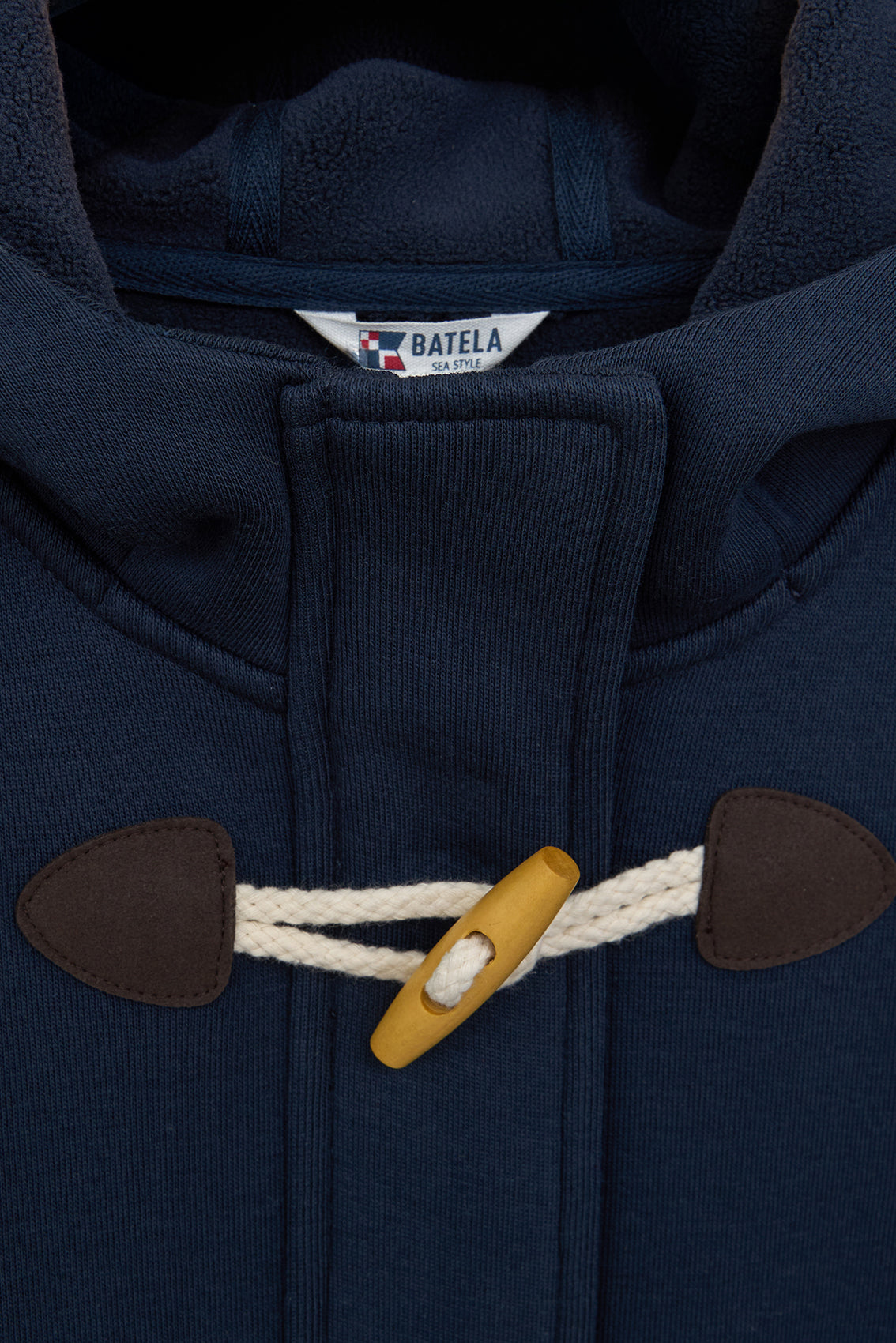 Chaqueta capucha botones tipo trenca