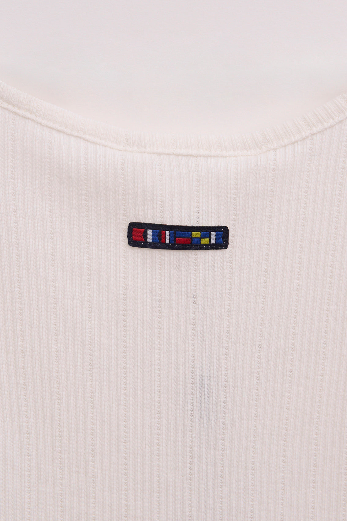 Top sin mangas en algodón pointelle