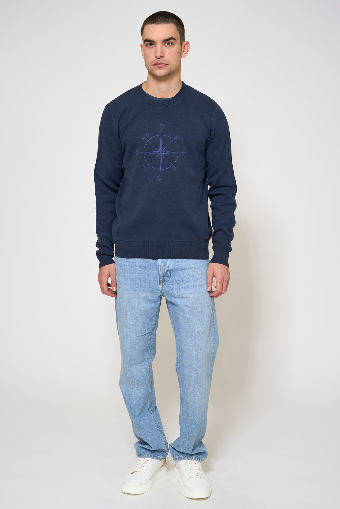 Knit sweater with embroidered compass