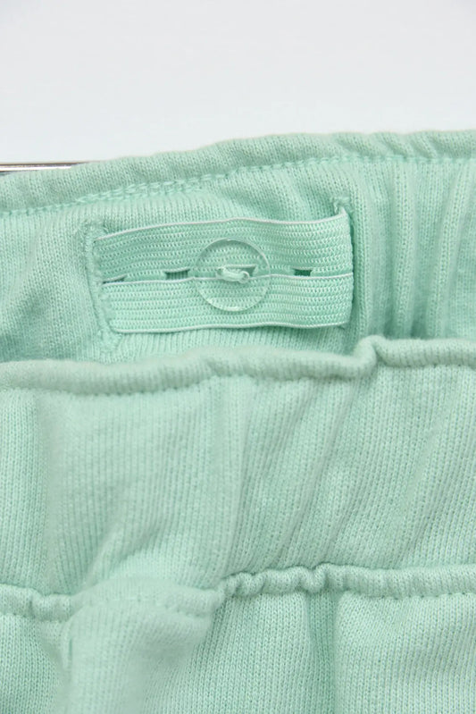 Cotton Bermuda shorts with embroidered 'As free as the ocean' detail