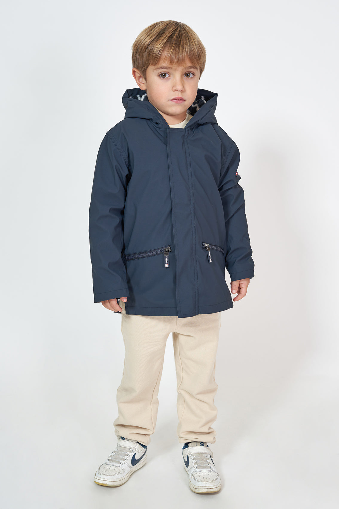 Kids’ polyurethane raincoat with fleece lining 