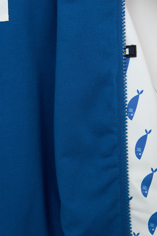 Printed cape-style baby raincoat with cotton lining