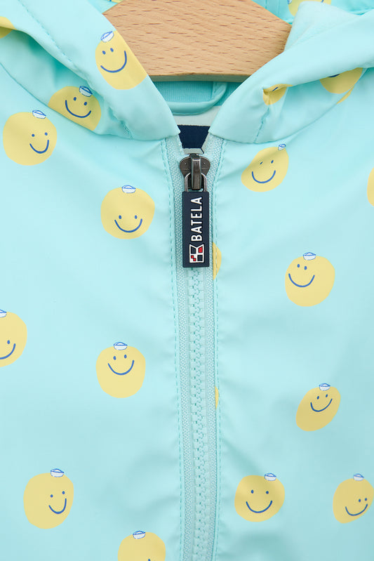 Printed cape-style baby raincoat with cotton lining