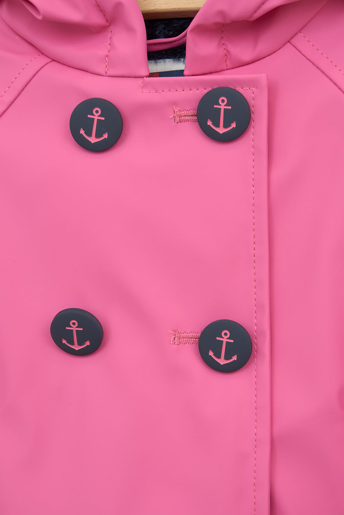 Baby raincoat with anchor buttons