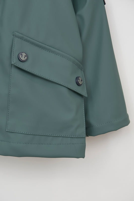 Baby raincoat with pockets and flaps