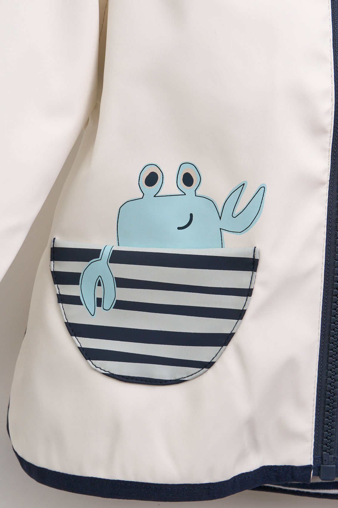 Imperméable bébé à poches crabe et doublure coton rayée