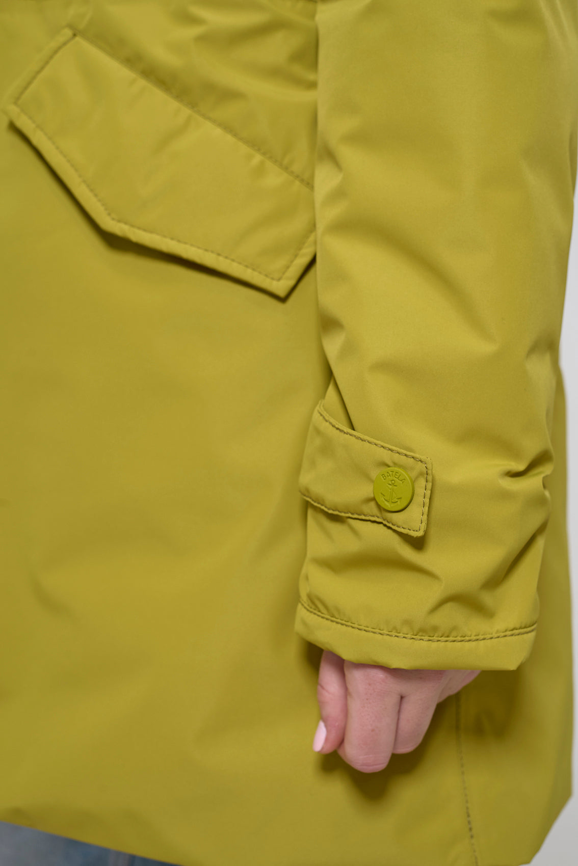 Waterproof coat with waist detail