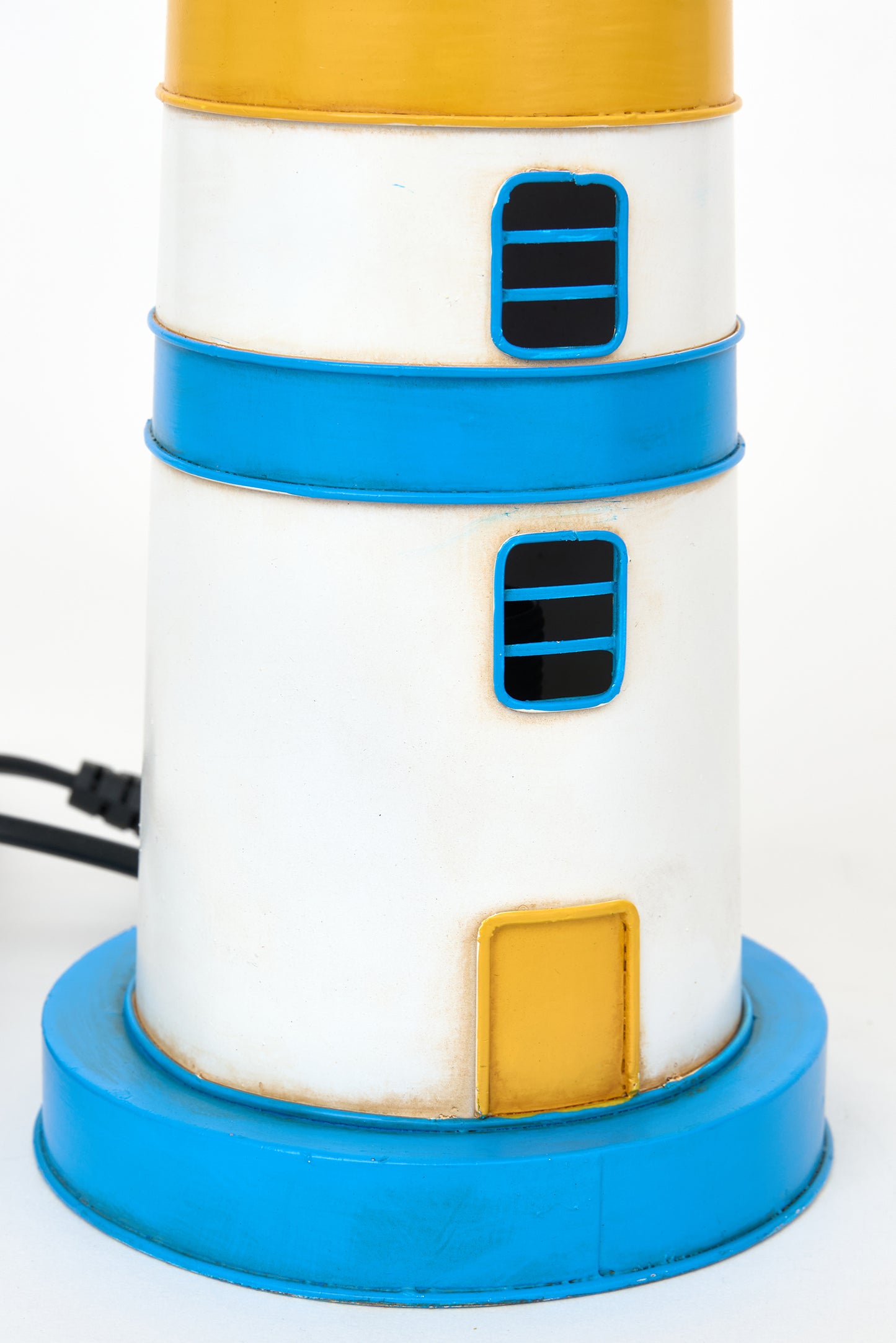Blue and yellow metal lighthouse lamp