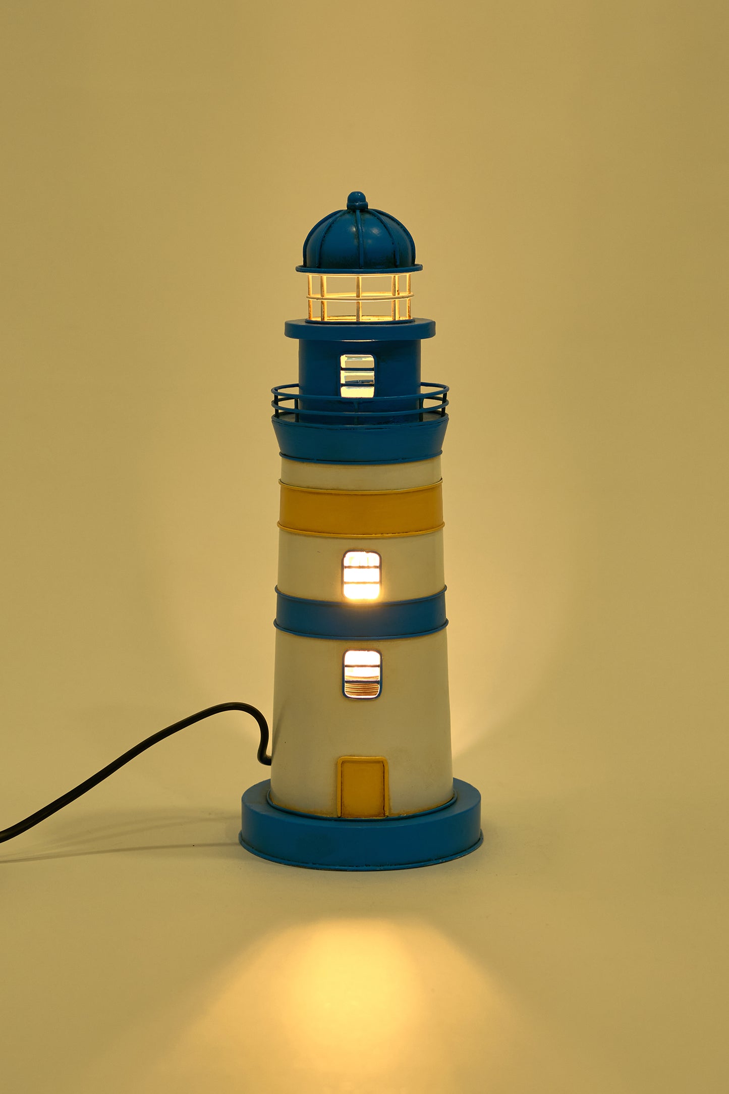Blue and yellow metal lighthouse lamp