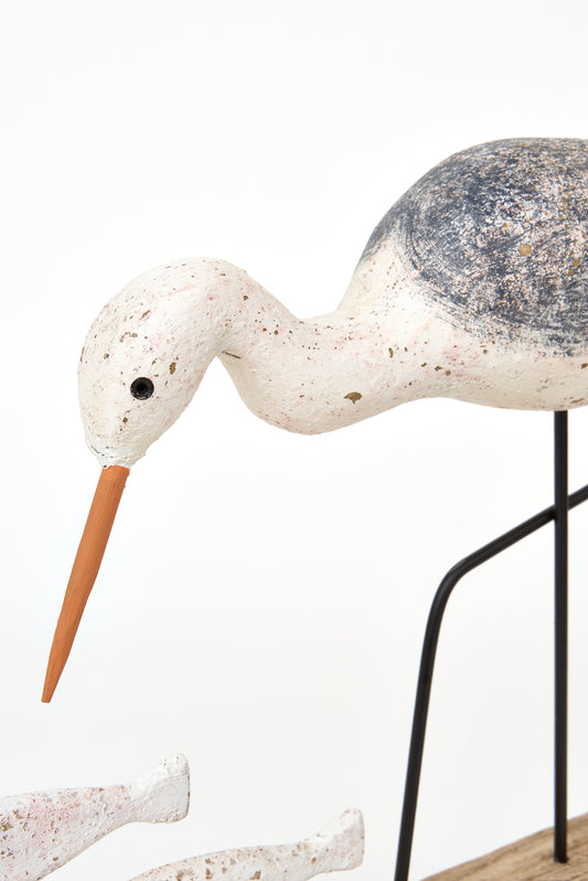 Decorative wooden bird figurine with fish