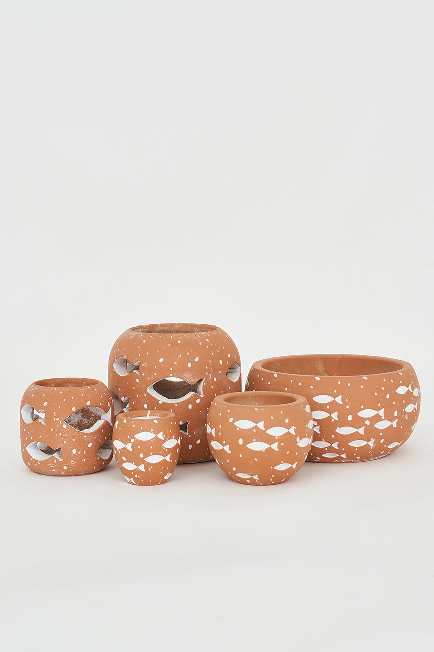 Large cement candle holder with perforated fish