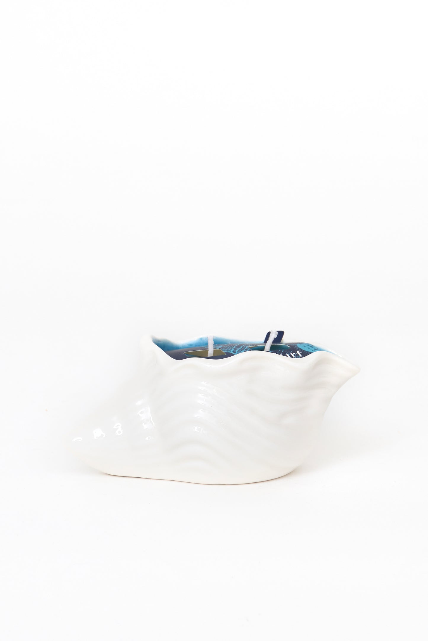 Vela decorativa en concha marina