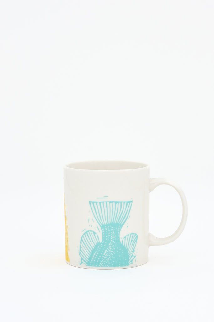 Taza en cerámica con colas de peces