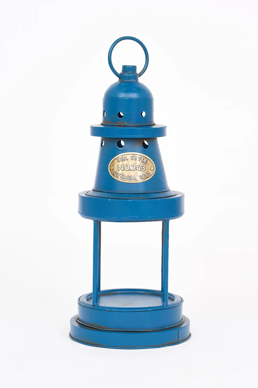 Portavelas forma de faro en metal