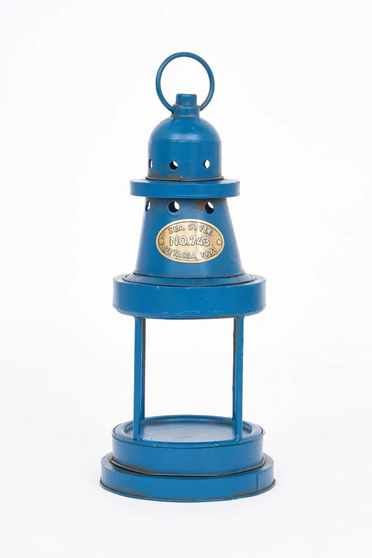 Portavelas forma de faro en metal