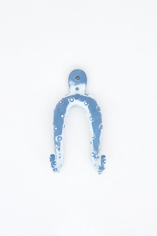 Perchero de metal con forma de pulpo