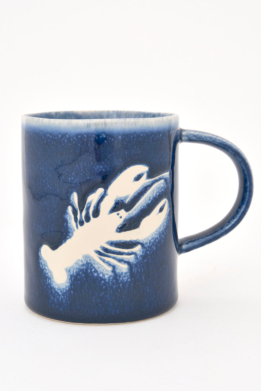 Gresezko katilua, urdin iluna, otarrainaren irudiarekin