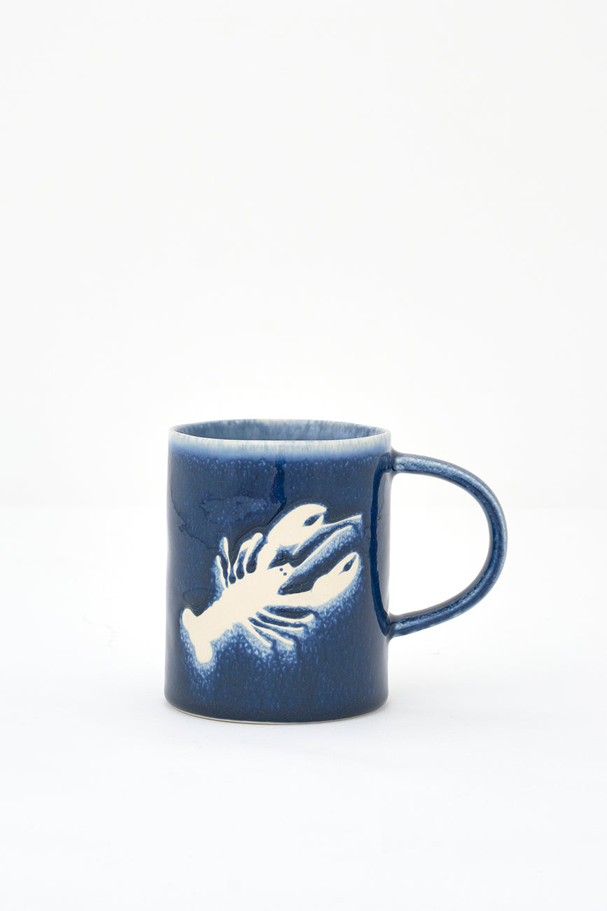 Gresezko katilua, urdin iluna, otarrainaren irudiarekin