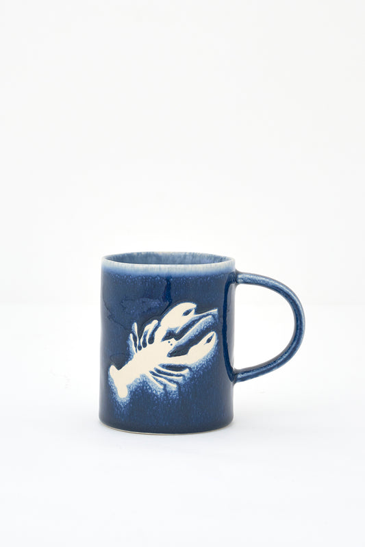 Gresezko katilua, urdin iluna, otarrainaren irudiarekin