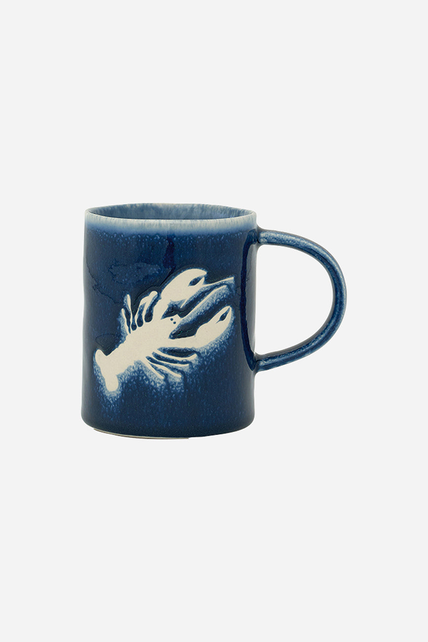 Gresezko katilua, urdin iluna, otarrainaren irudiarekin