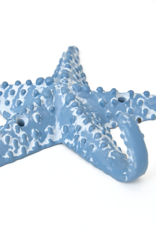 Colgador de metal con forma de estrella de mar