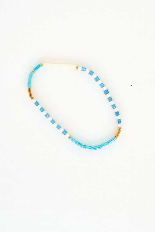 Pulsera marinera con perla de vidrio a rayas turquesa