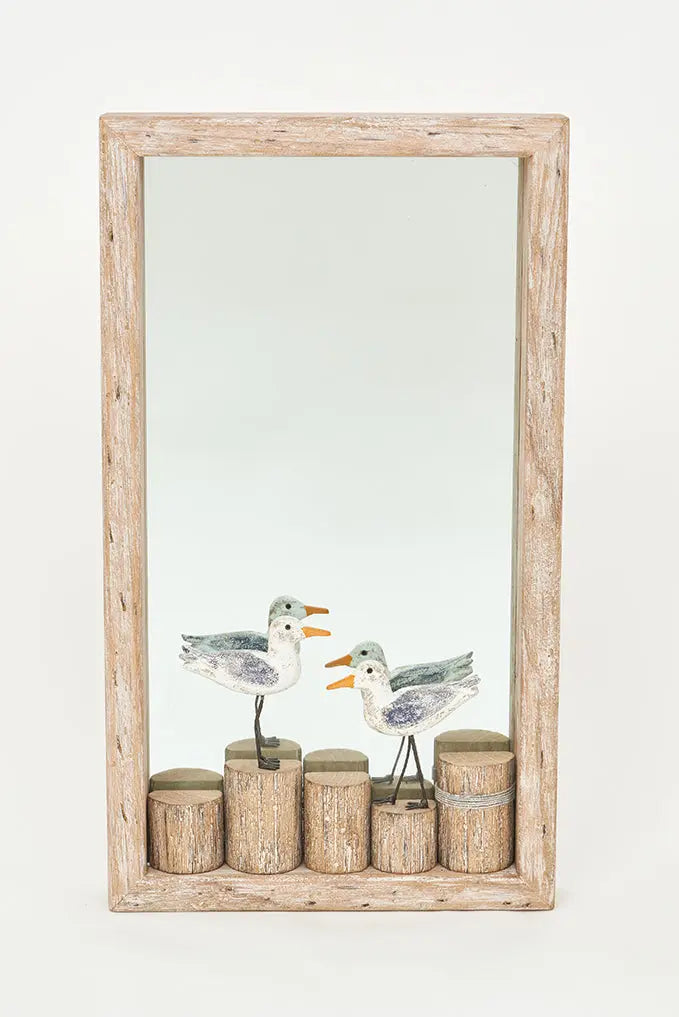 Espejo rectangular con pájaros sobre troncos