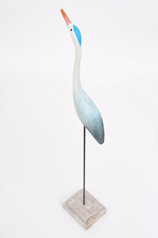 Pájaro con base hecho de madera en tonos azules y turquesa