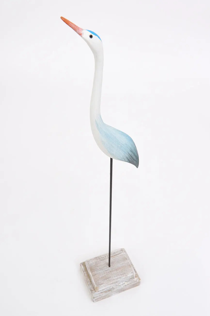 Pájaro con base hecha de madera en tonos azules y turquesa