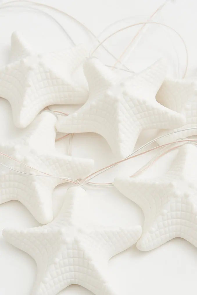 Guirnalda de farolillos con estrellas en resina