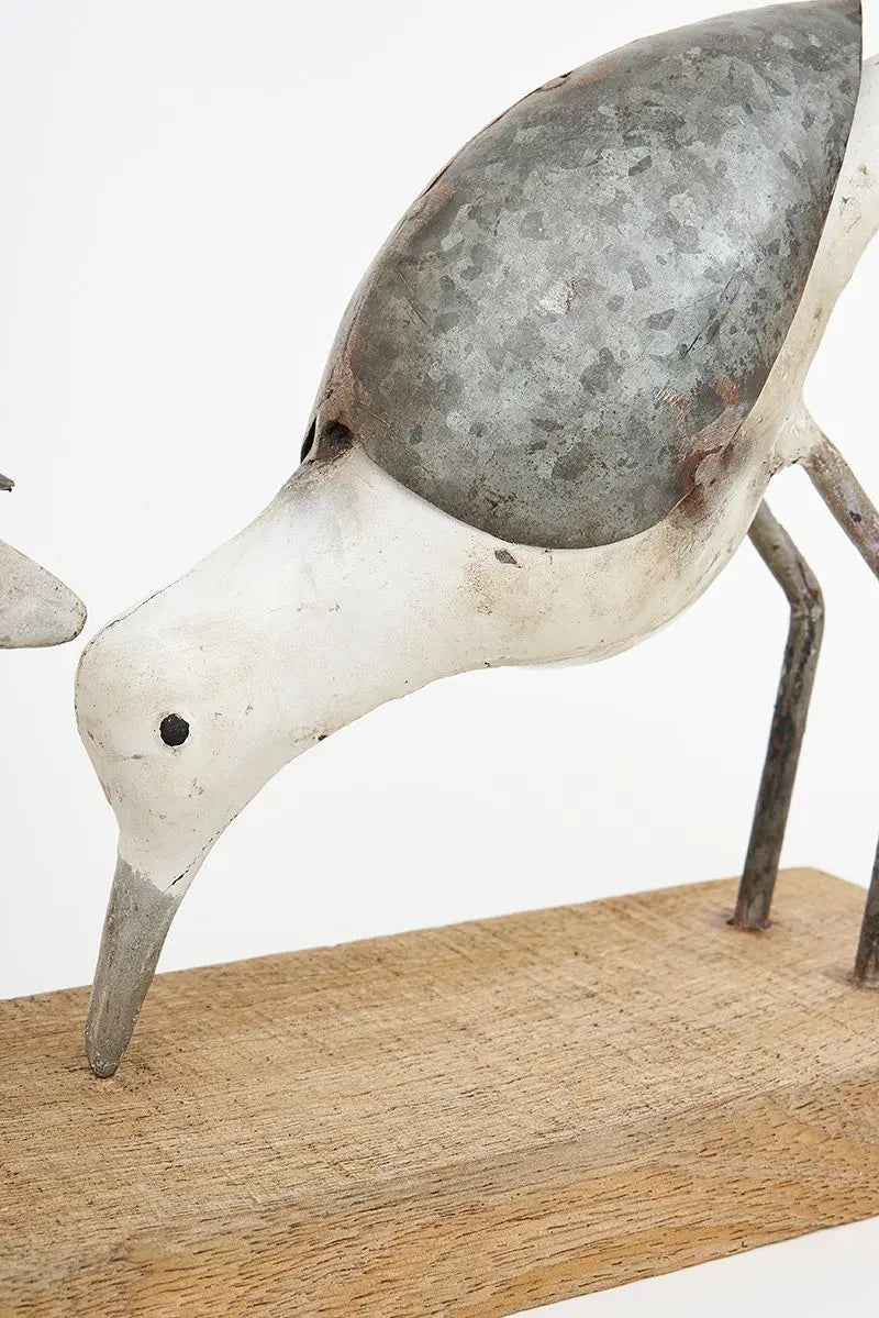 Two recycled metal birds