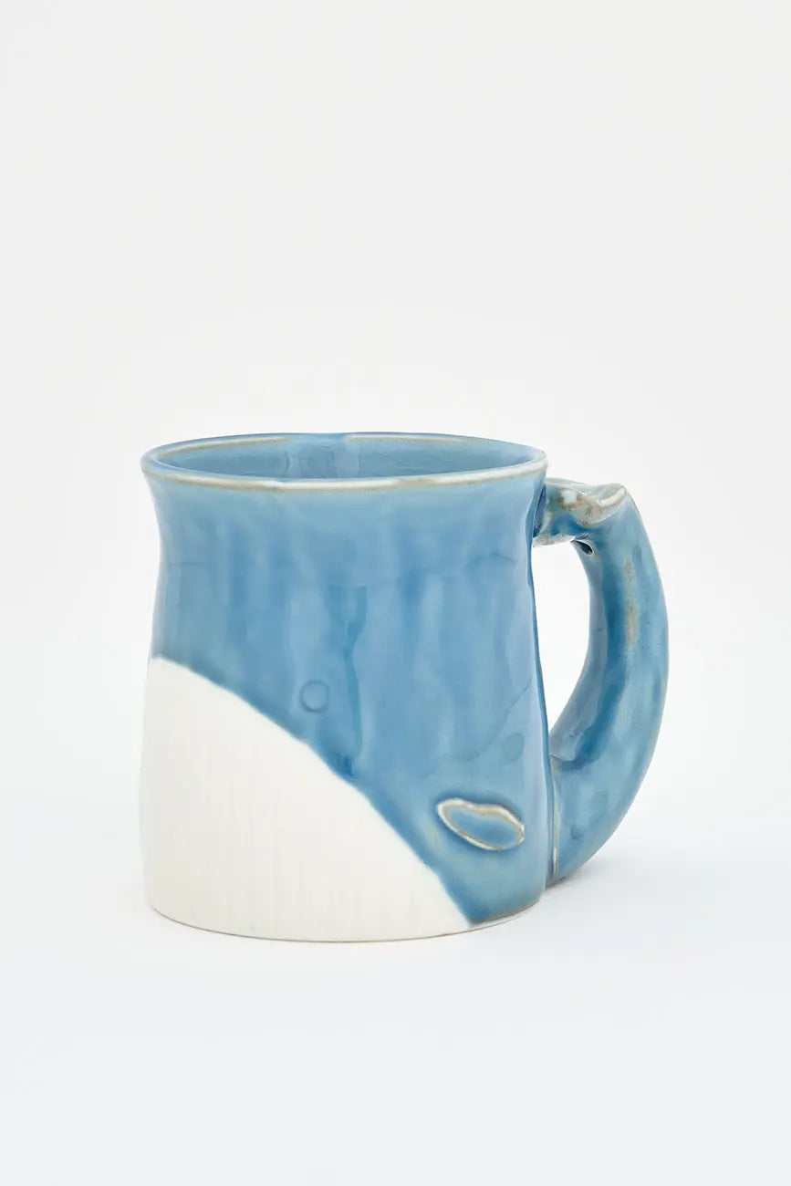 Blue porcelain mug in the shape of a whale