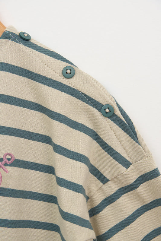 T-shirt manches longues à rayures avec des boutons sur l’épaule