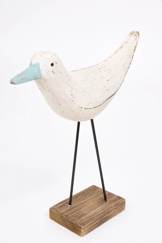 Figura de pájaro blanco y pico en contraste turquesa