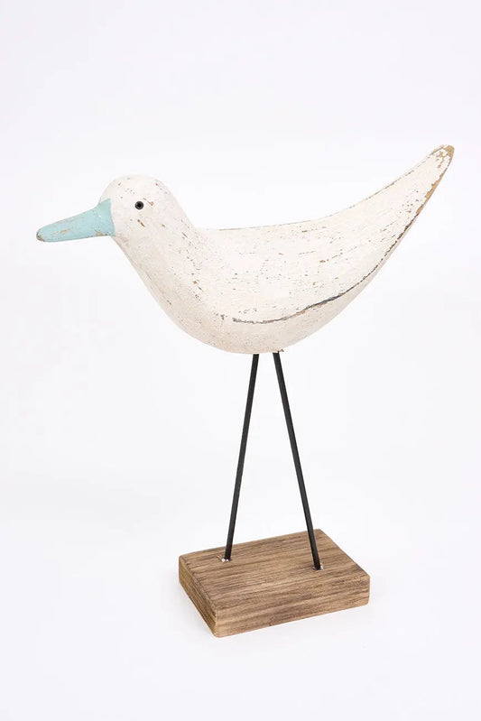 Figura de pájaro blanco y pico en contraste turquesa