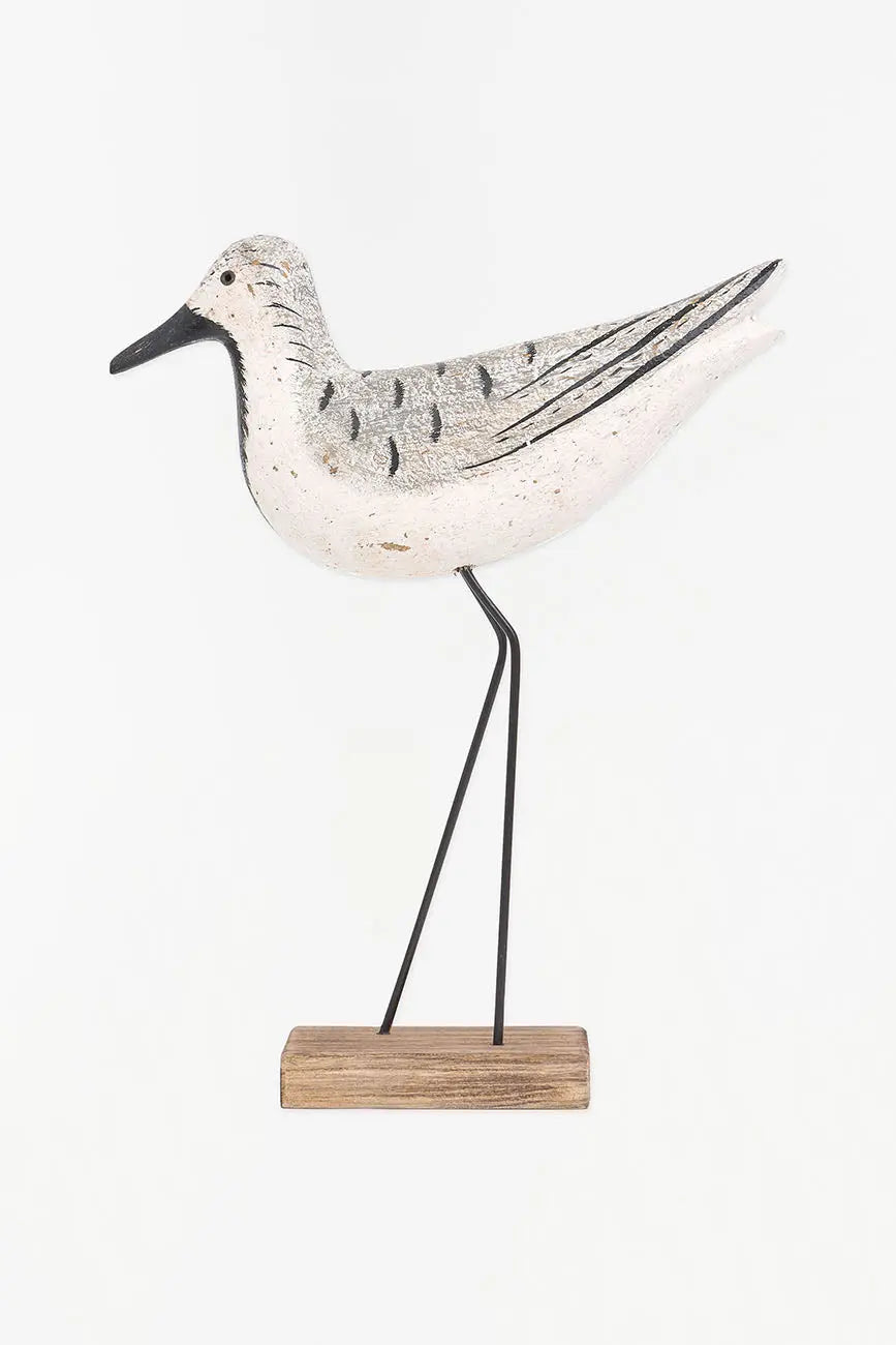 Pájaro de madera en tonos blancos, negros y grises