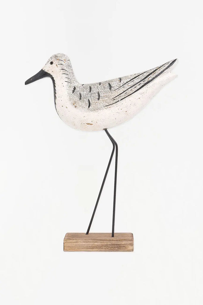 Pájaro de madera en tonos blancos, negros y grises