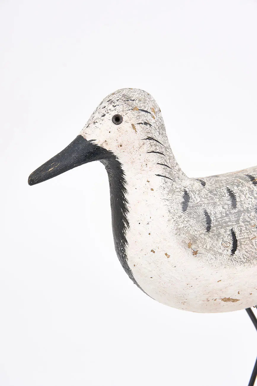 Wooden bird in white, black and grey tones