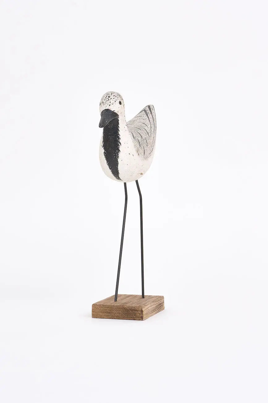 Wooden bird in white, black and grey tones