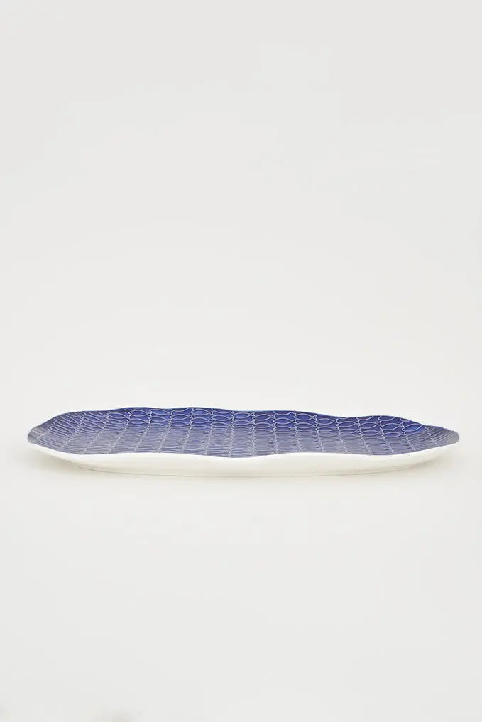 Assiette poissons en céramique bleue