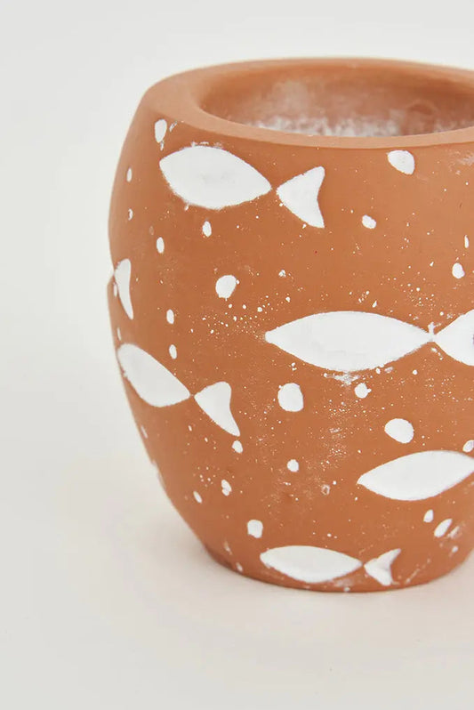 Portavelas de cemento con peces