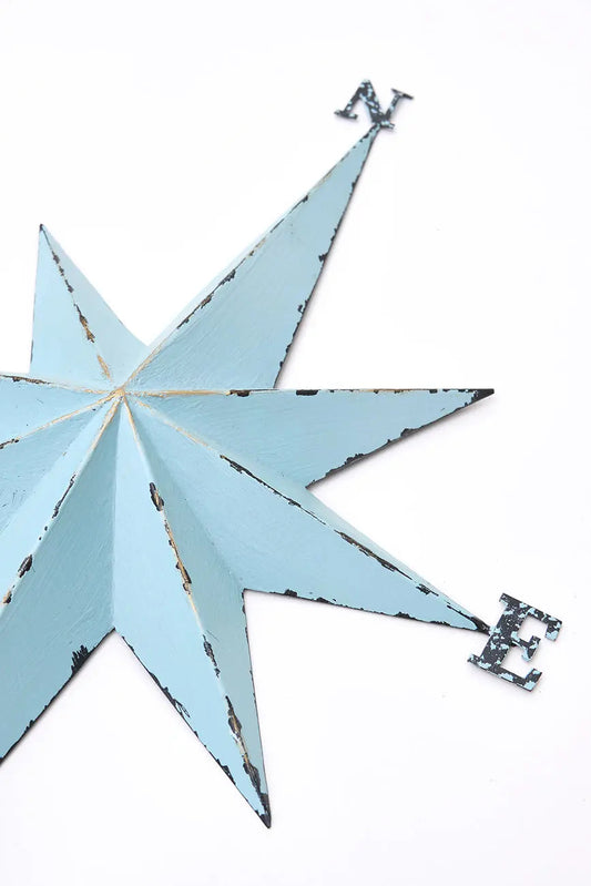 Rosa de los vientos hecha en metal