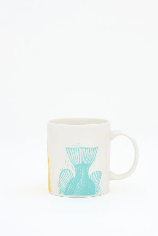 Taza en cerámica con colas de peces