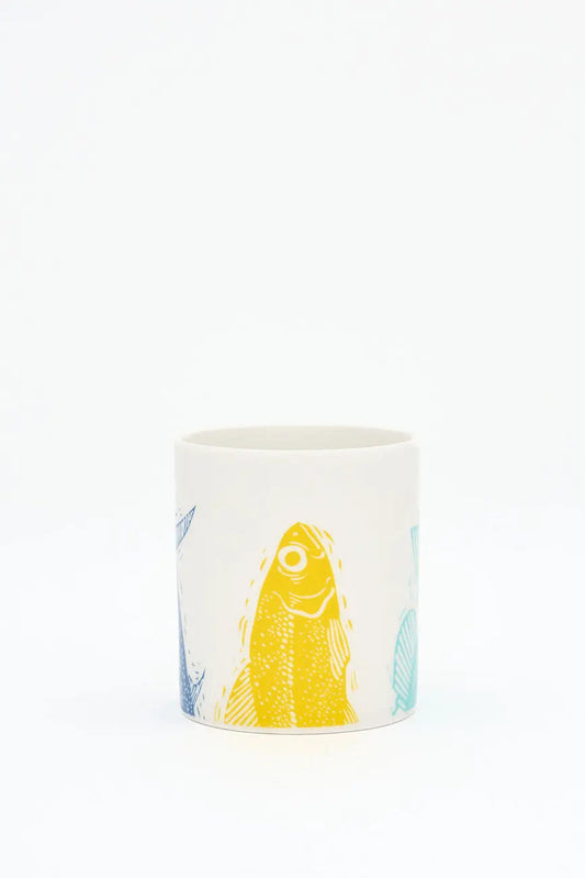 Taza en cerámica con colas de peces