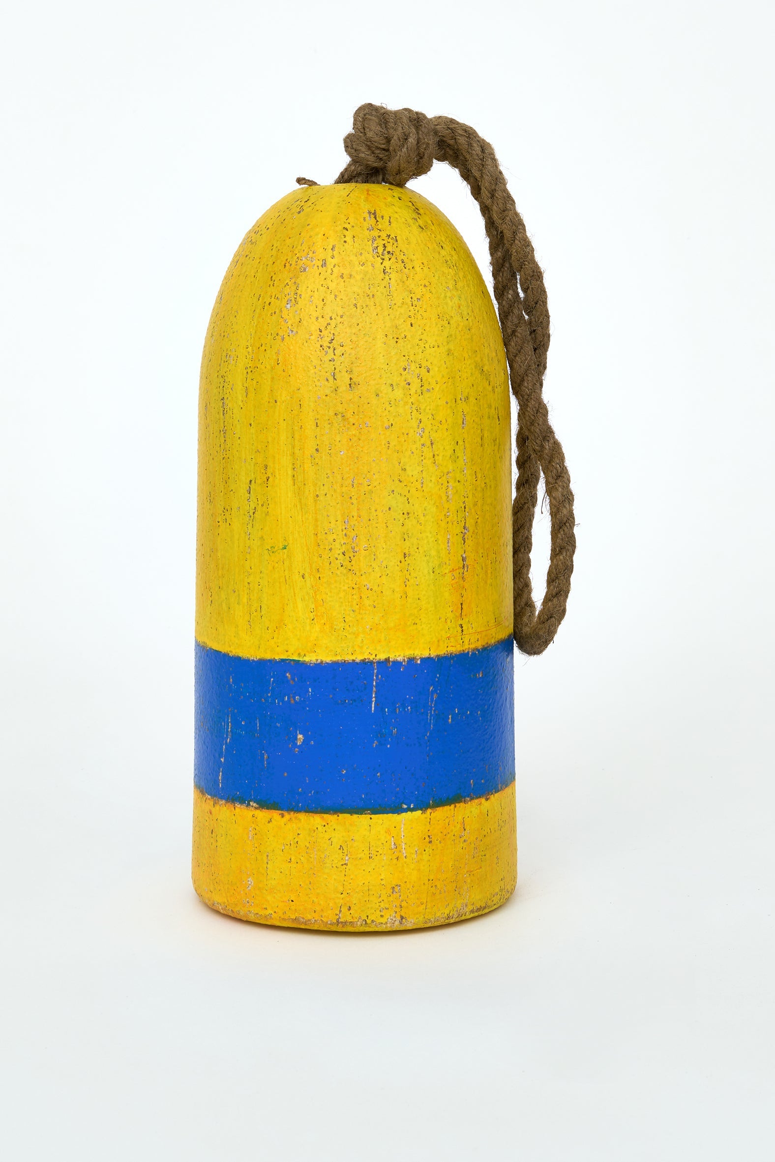 Yellow and blue decorative buoy with rope